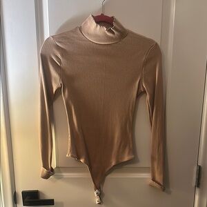 Elegant Tan Ribbed Turtleneck Bodysuit